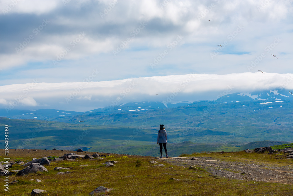 Asian woman travel enjoy season of summer in nature at Iceland, concept relax in nature