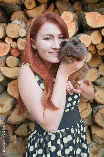 caucasian girl with her friend Guinea Pig together