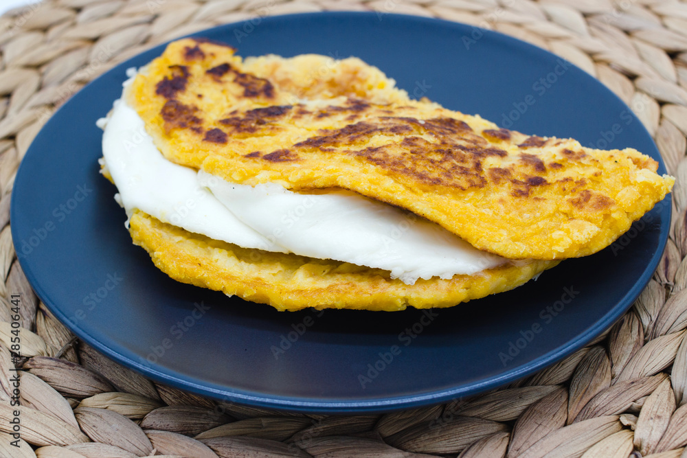 Cachapas on a rustic background. Close-up of Cachapa, a traditional food from Venezuela, Costa Rica and Colombia made with maize flour and cheese Cachapas on a rustic background. Close-up of Cachapa, a traditional food from Venezuela, Costa Rica and Colombia made with maize flour and cheese