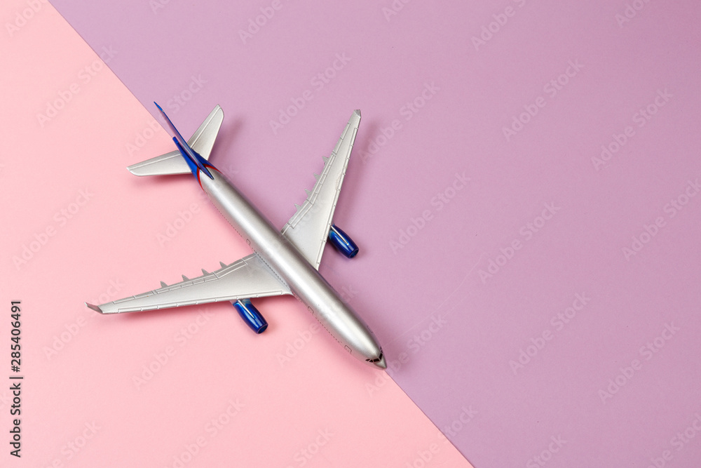 top view photo of toy airplane over color background . travel concept . top view photo of toy airplane over color background . travel concept .