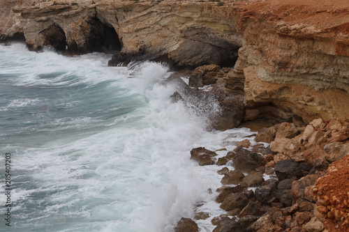 Rocky shore of Cyprus with waves crashing