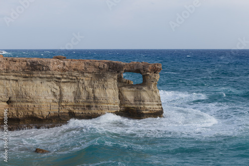 Rocky shore of Cyprus with waves crashing