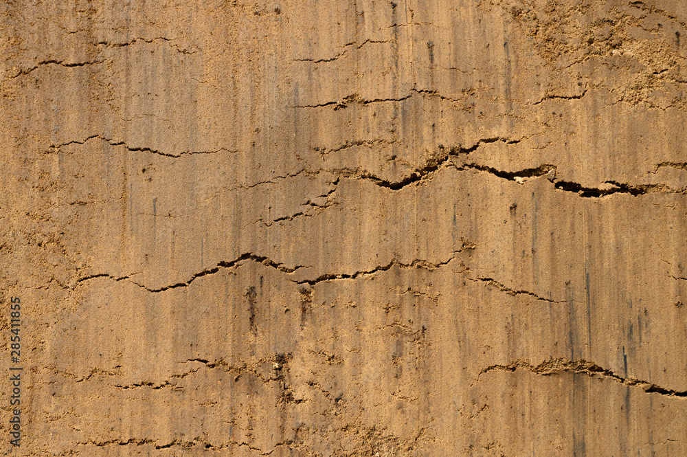 Obraz premium Textured ground surface as background, top view