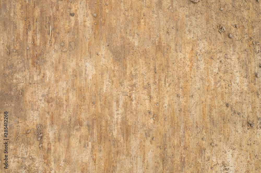 Textured ground and sand surface as background, top view Textured ground and sand surface as background, top view