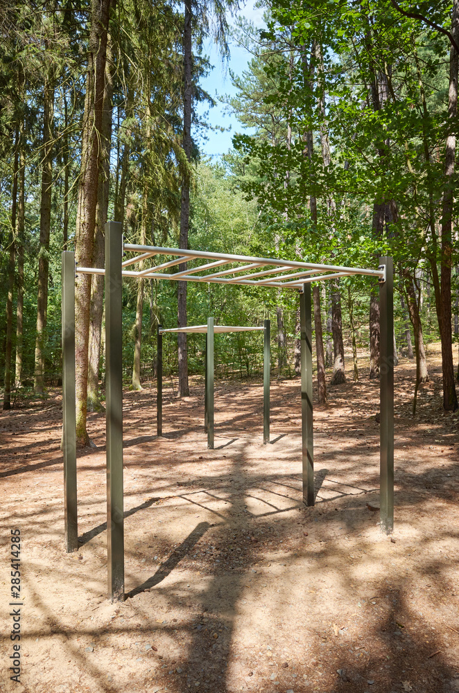 Pull up bars in a forest, outdoor gym equipment Pull up bars in a forest, outdoor gym equipment