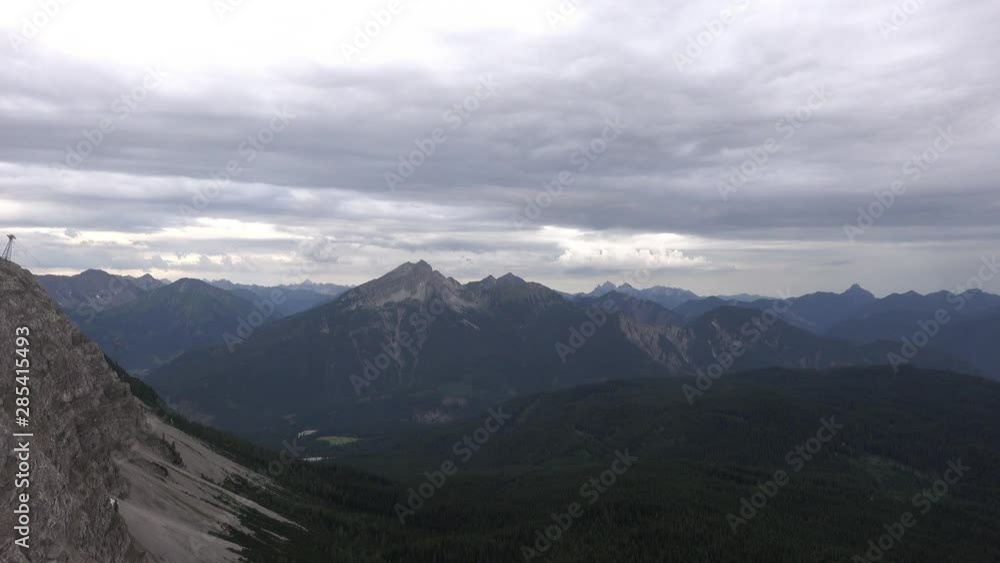 Foot of the Zugspitze, which rises rocky above the densely wooded foreland Foot of the Zugspitze, which rises rocky above the densely wooded foreland