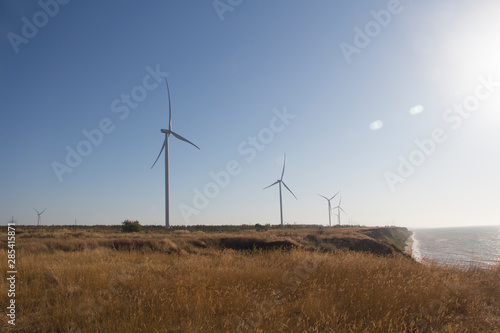 Industrial wind turbine generator by the sea
