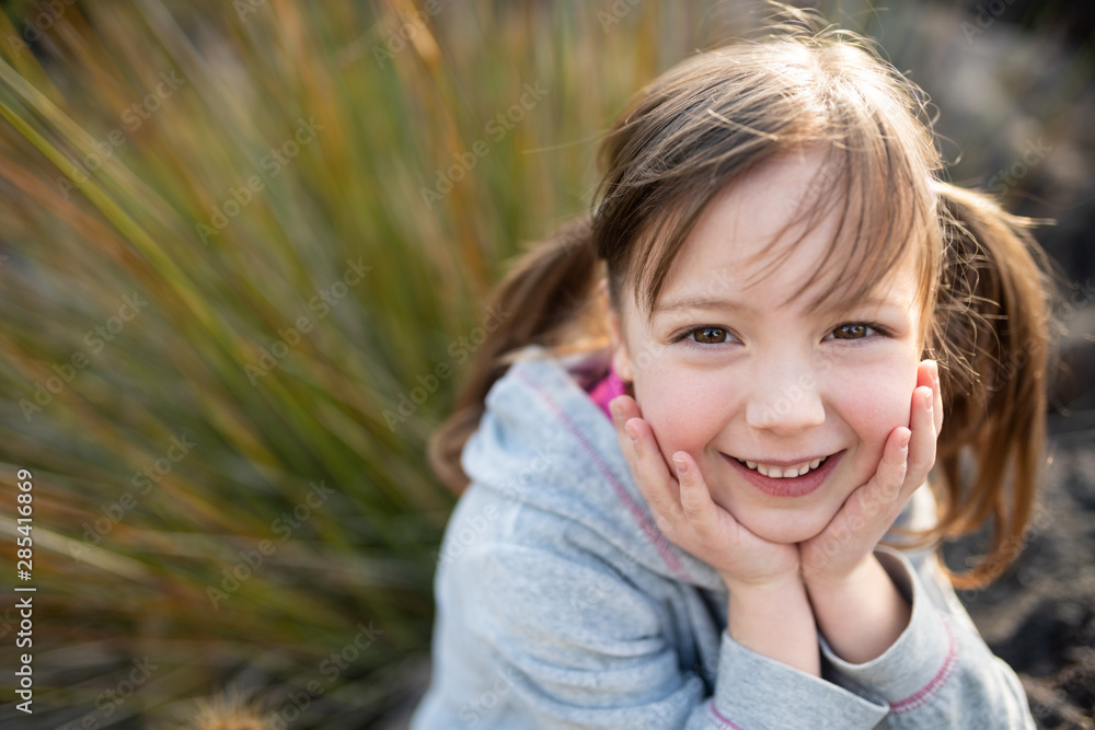Adorable little girl child looking directly into camera Adorable little girl child looking directly into camera