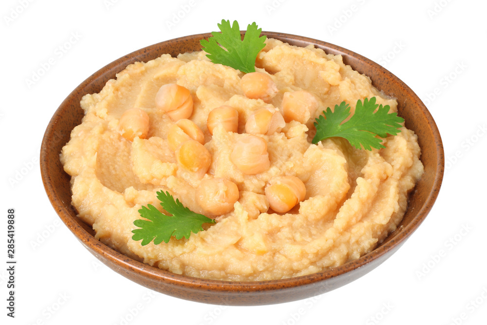 brown bowl with chickpea hummus isolated on white background
