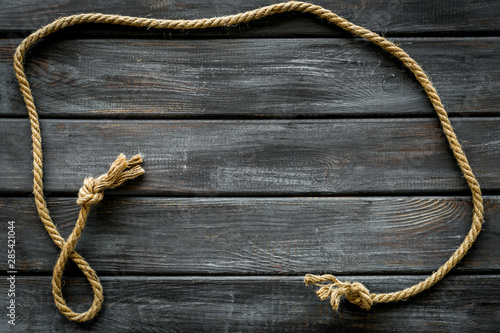 rope frame on wooden background top view mock up