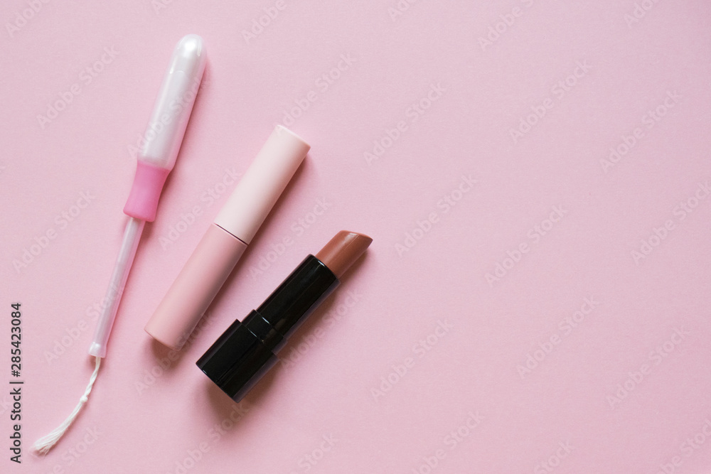 Beautiful flatlay of cosmetics and women's accessories on pink with place for text. Makeup, femininity, fashion, hygiene concept Beautiful flatlay of cosmetics and women's accessories on pink with place for text. Makeup, femininity, fashion, hygiene concept
