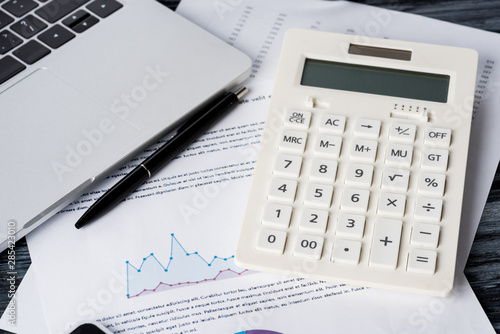 Calculator and charts on the table