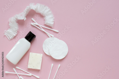 Beautiful flatlay hygienic and women's accessories on pink with place for text. Hygiene, femininity, medicine, health care concept