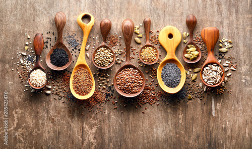 Oilseeds on wooden background