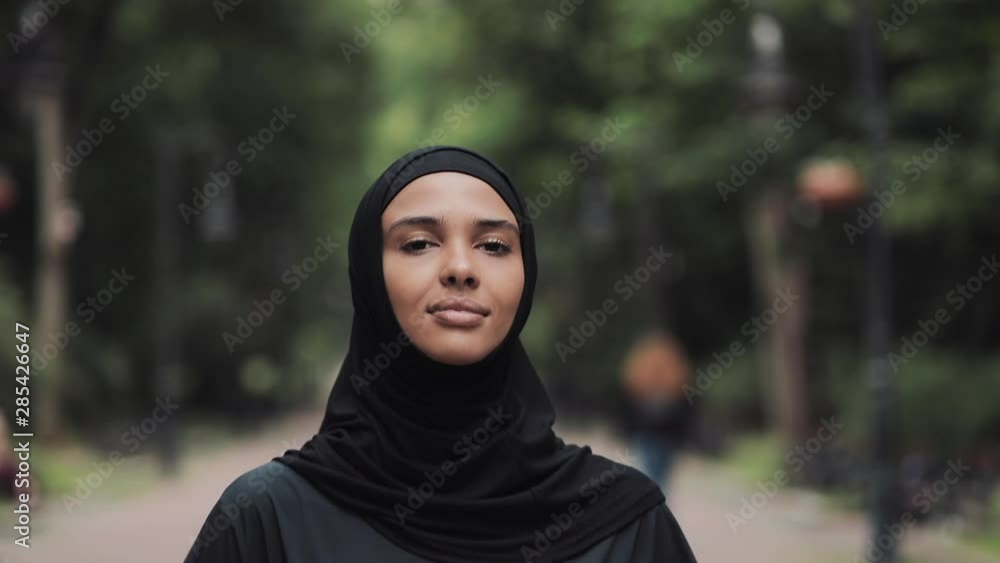 Young Preety Muslin Girl Wearing a Hijabt Running in the Park Concept Healthy Lifestyle Close Up. Young Preety Muslin Girl Wearing a Hijabt Running in the Park Concept Healthy Lifestyle Close Up.