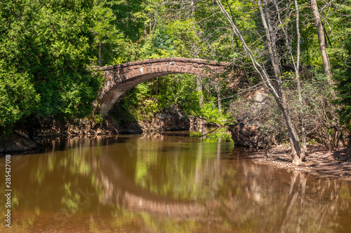 Stone Arch Footbridge Over Creek