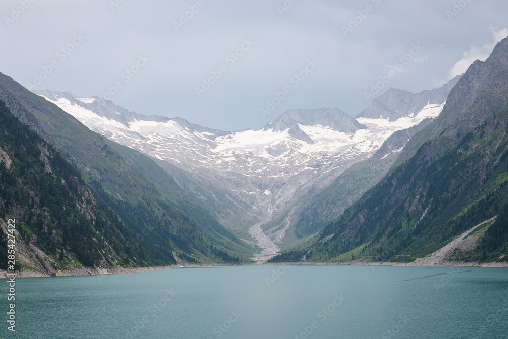 Obraz premium View of glacier and lake in the Alps near the border of Austria and Italy