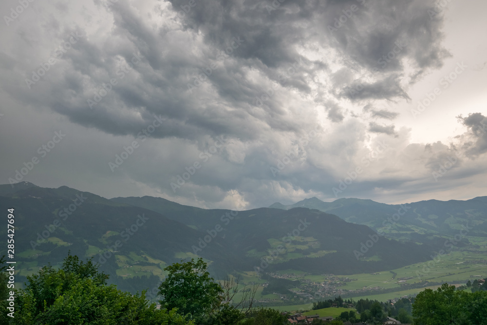 Obraz premium Dramatic sky of a thunderstorm cloud over the Alps, central Europe