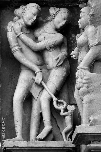Close up of Kamasutra Poses/scenes carved on the outside wall of temples in Western Group of Temples, Khajuraho, Madhya Pradesh
