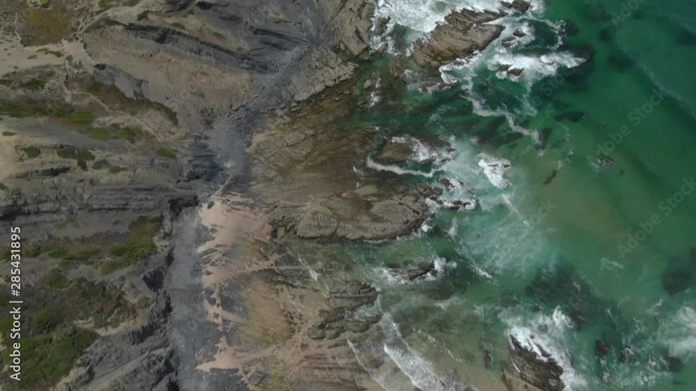 Aerial drone close up view of ocean waves moving Aljezur Algarve coastline wild beach, Portugal Aerial drone close up view of ocean waves moving Aljezur Algarve coastline wild beach, Portugal