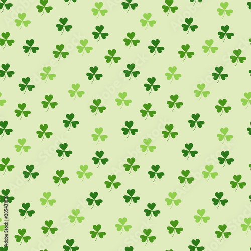 Seamless pattern with green clover on a white background