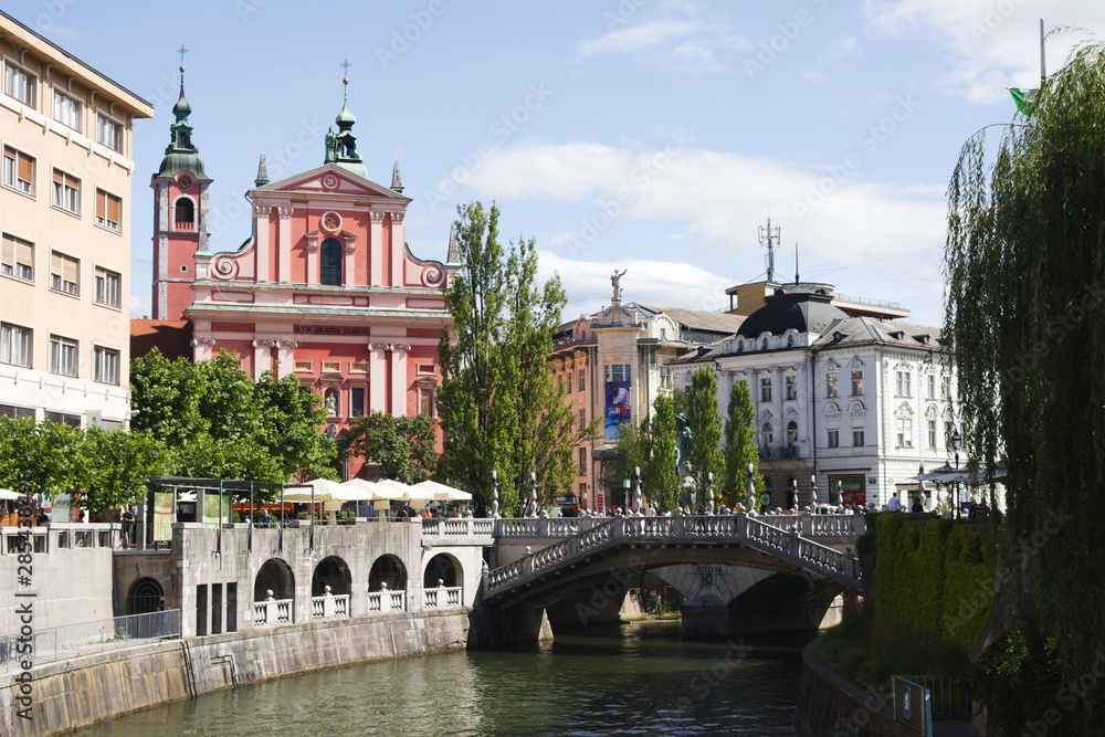 View of Ljubljana city center with fransiscan church and triple bridges