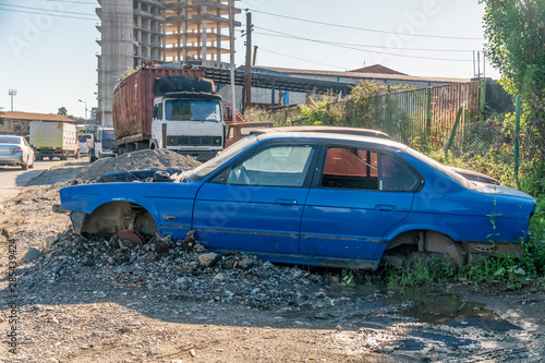 Disassembled, broken blue car on the streets of Batumi photo