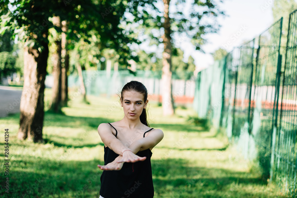 Young beautiful girl doing yoga outdoors in the park Young beautiful girl doing yoga outdoors in the park