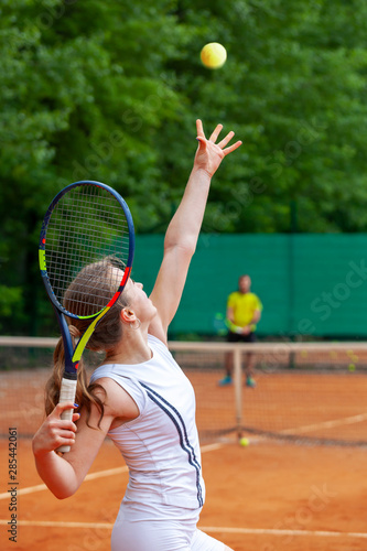 Young female tennis player serving. © Dmytro Panchenko