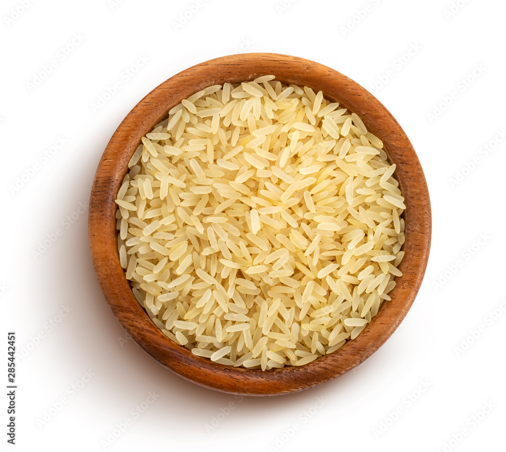 Parboiled rice groats isolated on white background, top view Parboiled rice groats isolated on white background, top view