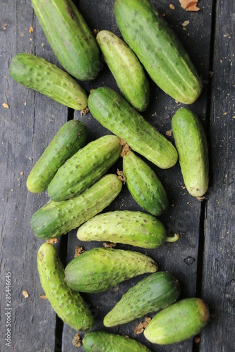 Fresh ripe cucumbers lie on the table, rural market