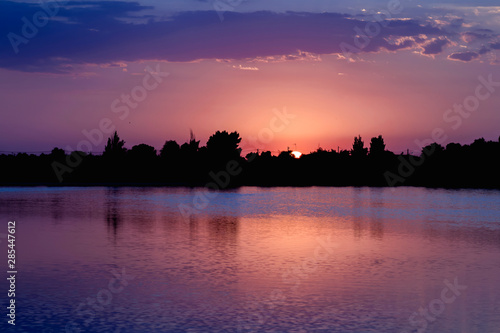 Colorful sunset landscape in Villafranca de los Caballeros lagoon, Spain