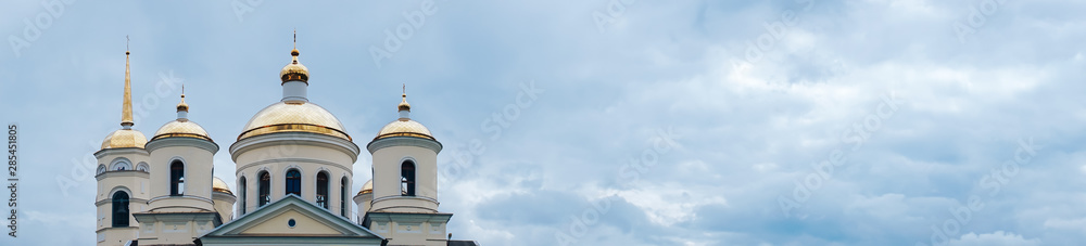 panorama of the church in the blue sky with white clouds panorama of the church in the blue sky with white clouds