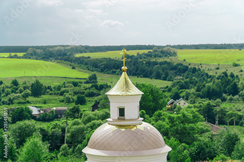 panorama of the church on a background of green countryside in summer