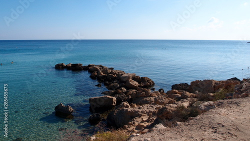 Rocky scythe leaves in the calm blue sea