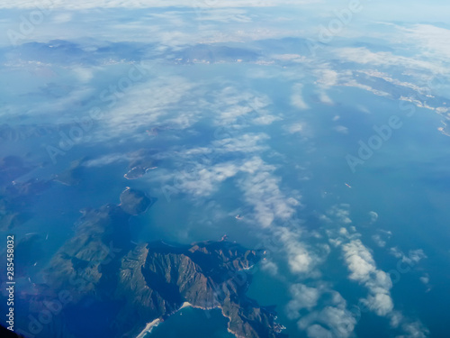 Top aerial view travel of island nature mountain clouds from airplane