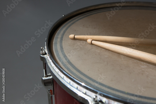 percusions drums with drumsticks on it close-up