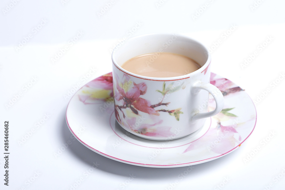 traditional English cup of tea. English cup of tea served someone. isolated on a white background. traditional English cup of tea. English cup of tea served someone. isolated on a white background.