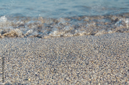 Wallpaper Mural Closeup of sandy beach with soft incoming waves. Selective focus Torontodigital.ca