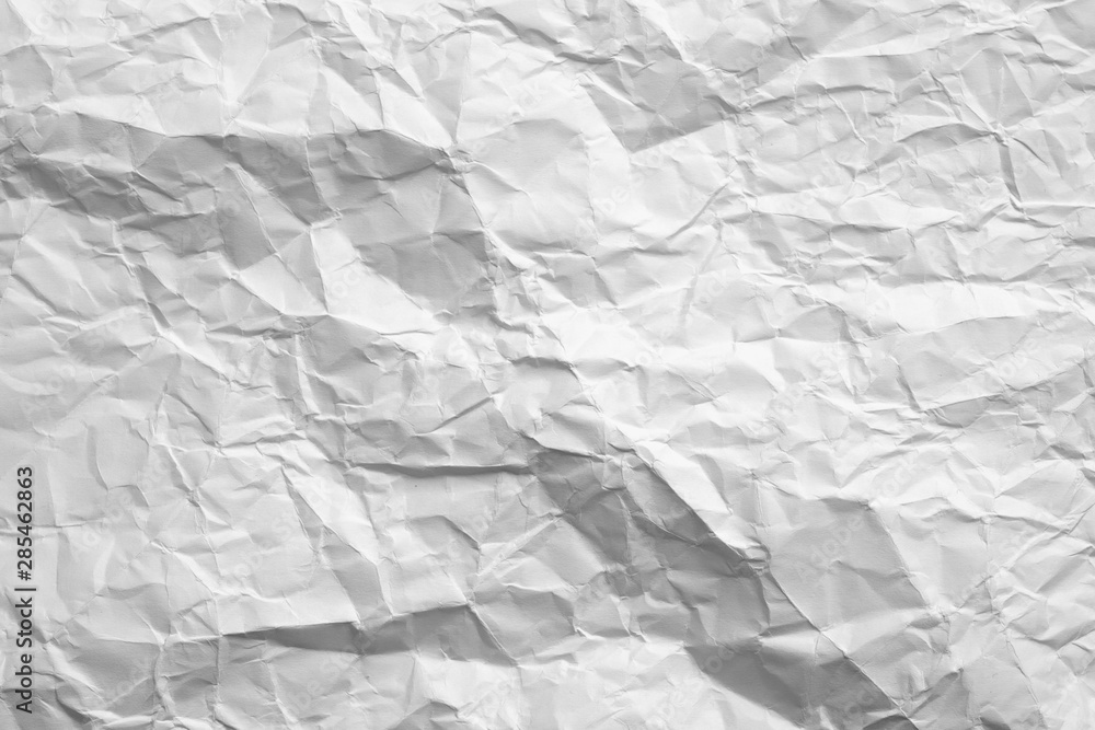 Fototapeta premium Blank white crumpled paper with gray shades. Aged texture. Minimalist design. Abstract art background. Copy space.