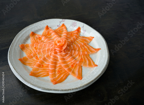 Slices of raw Salmon sashimi on dish