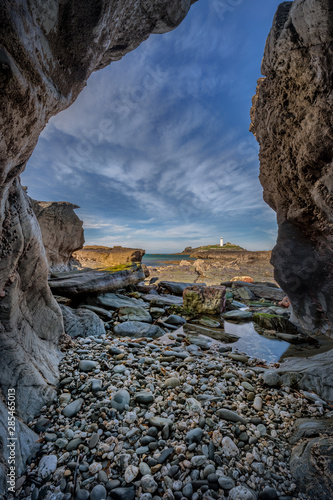Photo Rocky Vista, Godrevy Lighthouse, Cornwall, with view through rocks at LowTide