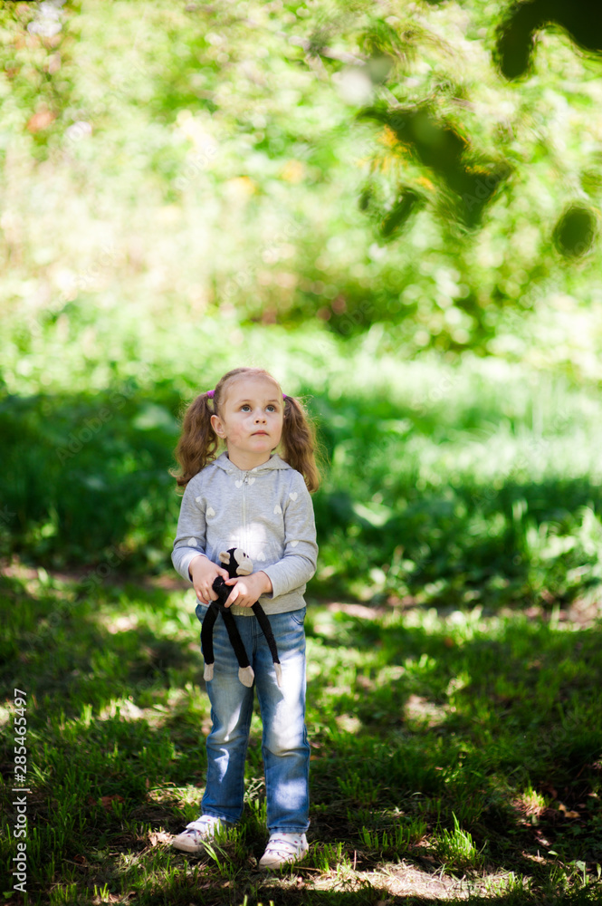 Portrait of a little girl scared in the forest Portrait of a little girl scared in the forest