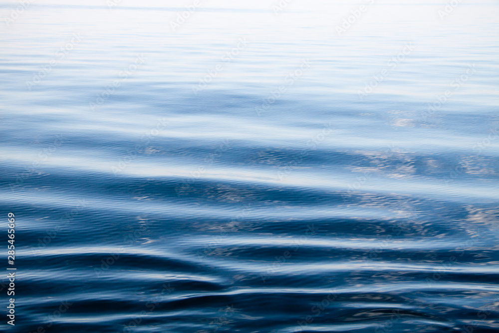 Naklejka premium Water surface with small ripples, horizontal closeup, Venice