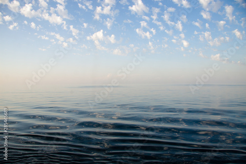 Fototapeta Naklejka Na Ścianę i Meble -  Blue seawater surface with clouds in the sky, Venice
