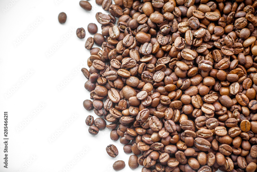 Roasted coffee beans heap background