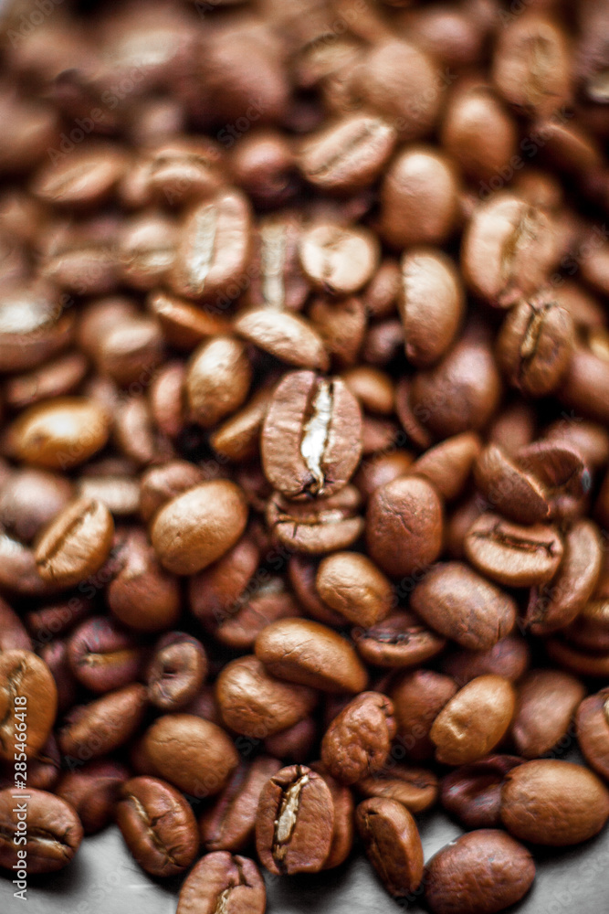 Roasted coffee beans heap background Roasted coffee beans heap background
