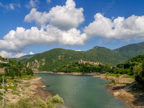 View of Lago ie Lake Vagli in Garfagnana, province of Lucca, Italy with Vagli Sotto village visible.It is a madmade reservoir for hydroelectric energy photo