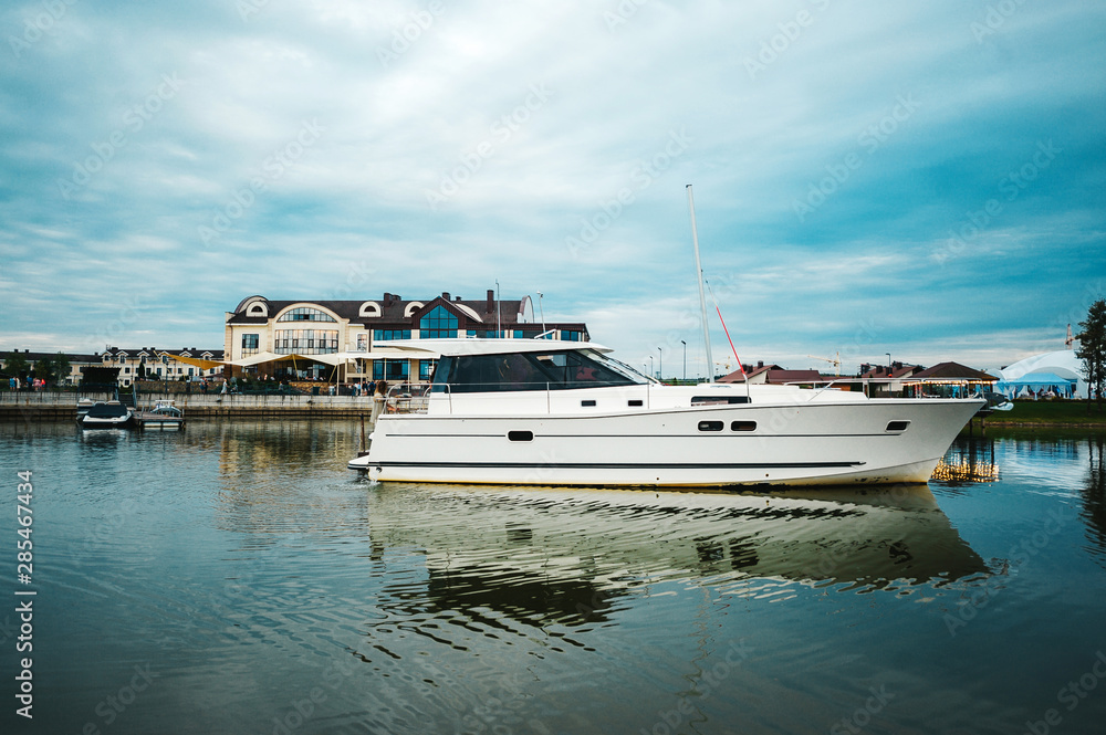 Fototapeta premium Yacht in the port near the pier.
