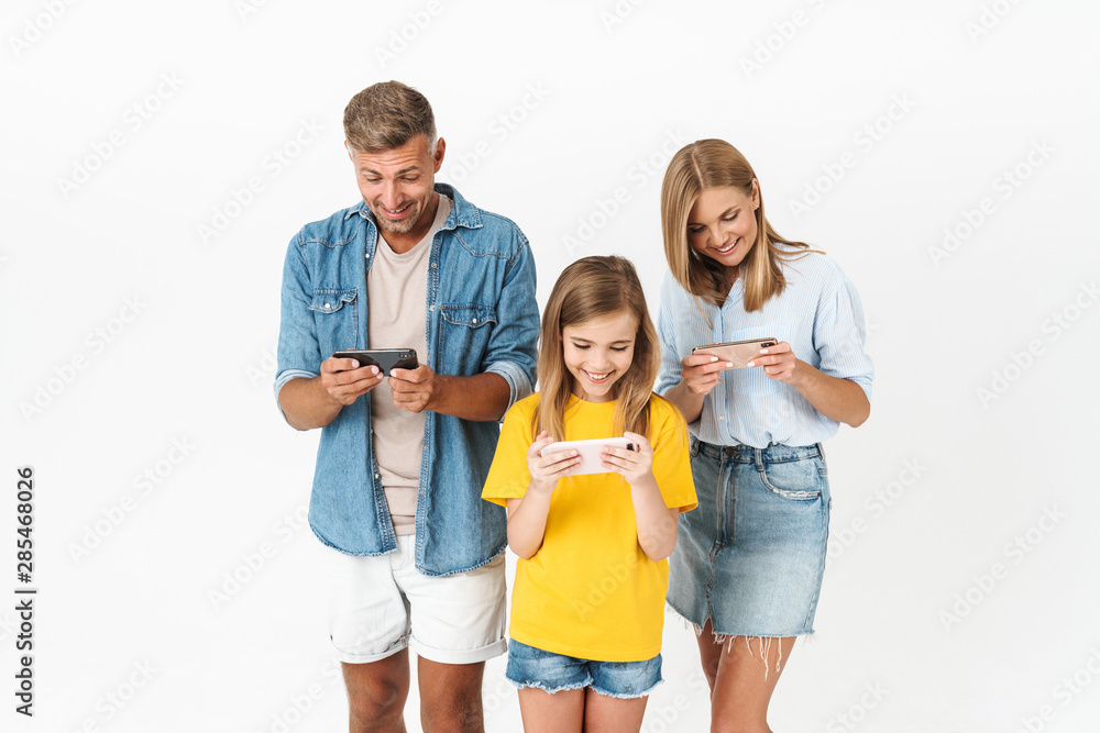 Obraz premium Cheerful family wearing casual outfit standing isolated